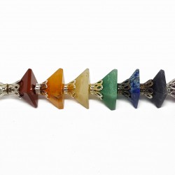 Healing stick made of the seven chakra stones with edge and crown made of quartz